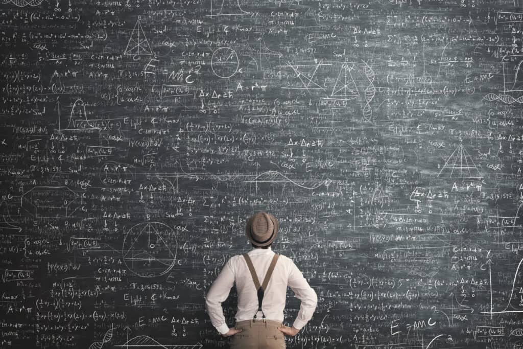 Person standing before math blackboard