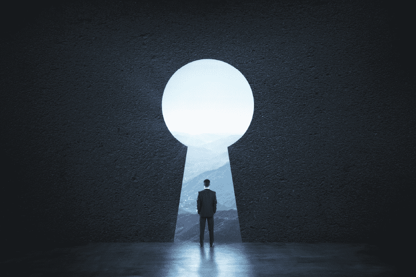 Man standing in front of a key hole